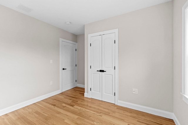 unfurnished bedroom with light hardwood / wood-style floors