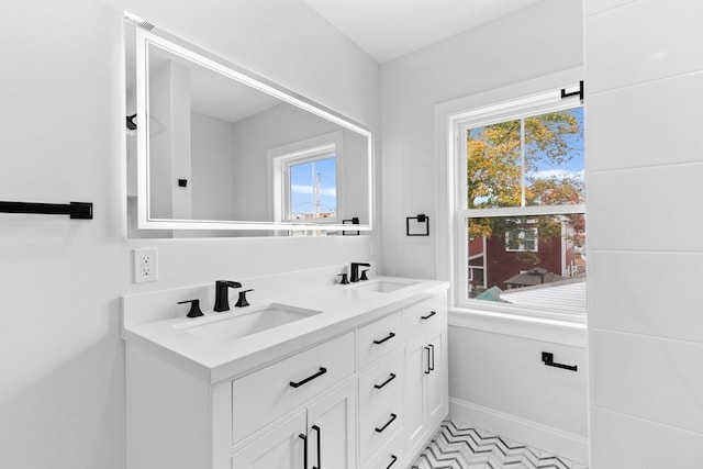 bathroom featuring a wealth of natural light and vanity