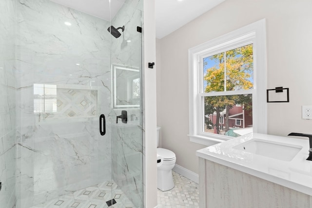 bathroom featuring vanity, toilet, walk in shower, and tile patterned flooring