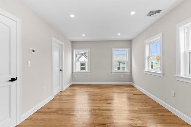 unfurnished room featuring light hardwood / wood-style flooring