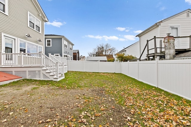 view of yard with a wooden deck