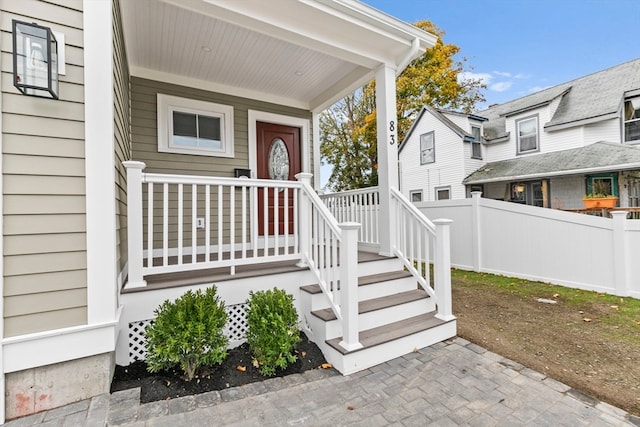 doorway to property featuring covered porch