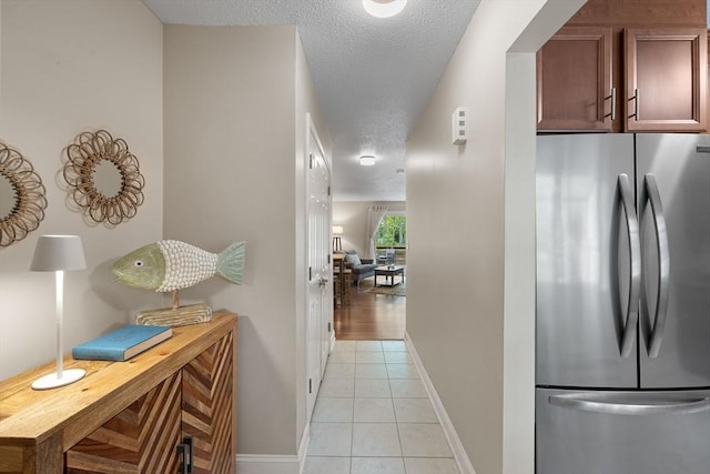 15 Roundhouse Rd Unit 15, Bourne, MA 02532 - hall with a textured ceiling, light tile patterned floors, and baseboards