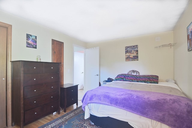 bedroom with wood-type flooring