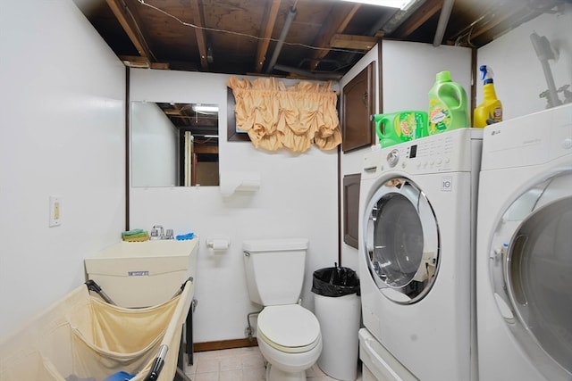 clothes washing area with washer and dryer