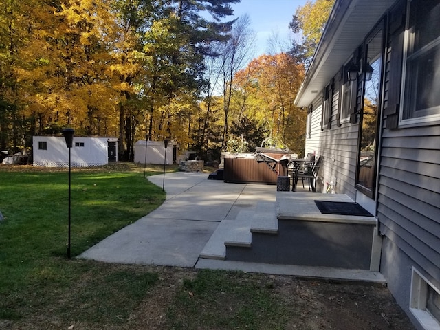 view of patio / terrace with a hot tub