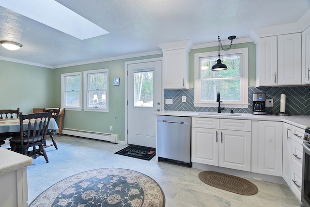 kitchen with a baseboard heating unit, stainless steel appliances, sink, and white cabinets