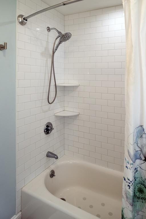 full bath featuring shower / tub combo with curtain
