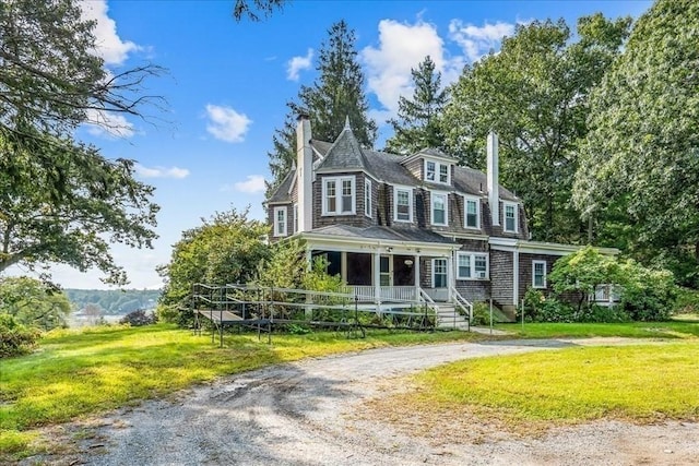 48 Neal Gate St, Scituate, MA 02066 - shingle-style home featuring a chimney, curved driveway, covered porch, and a front lawn