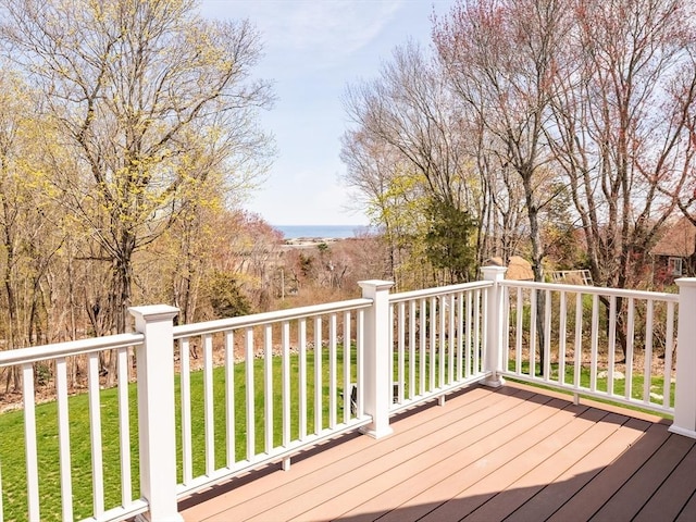 wooden deck with a lawn