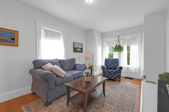 246 Railroad Ave, Norwood, MA 02062 - living room featuring baseboards and wood finished floors