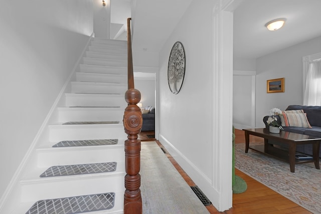 246 Railroad Ave, Norwood, MA 02062 - stairs featuring wood finished floors and baseboards