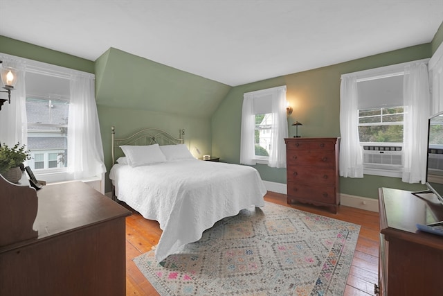246 Railroad Ave, Norwood, MA 02062 - bedroom with hardwood / wood-style floors, cooling unit, and lofted ceiling
