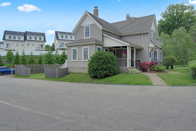 246 Railroad Ave, Norwood, MA 02062 - view of front of home with a chimney and a porch