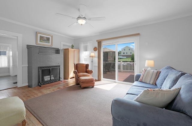 246 Railroad Ave, Norwood, MA 02062 - living room with crown molding, a fireplace, ceiling fan, and wood finished floors