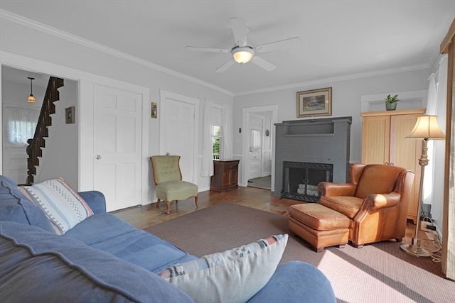 246 Railroad Ave, Norwood, MA 02062 - living area featuring stairs, a fireplace with flush hearth, ceiling fan, ornamental molding, and wood finished floors
