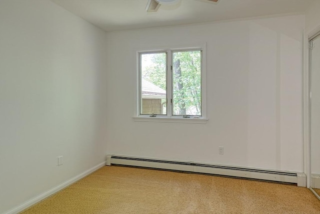 unfurnished room featuring a baseboard heating unit, baseboards, and ceiling fan
