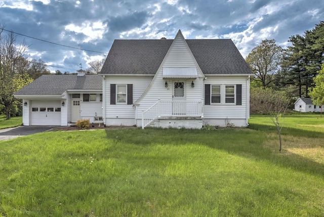 view of front of home featuring a garage, asphalt driveway, a front lawn, a shingled roof, and a chimney