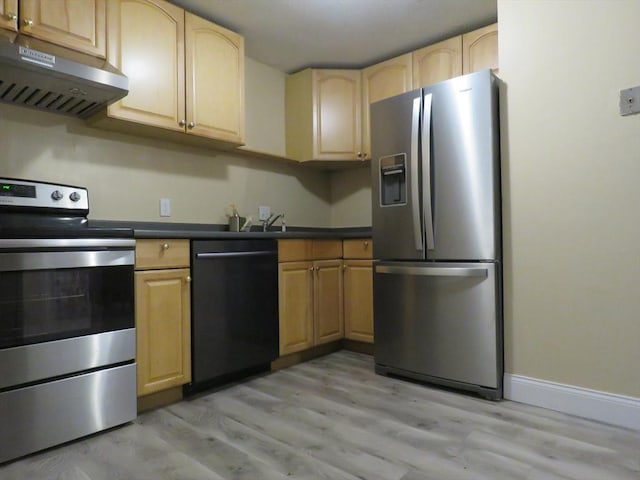 kitchen with stainless steel appliances, light brown cabinetry, range hood, and light wood-type flooring