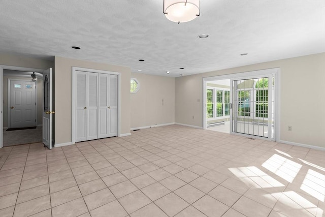 unfurnished living room featuring baseboards and recessed lighting