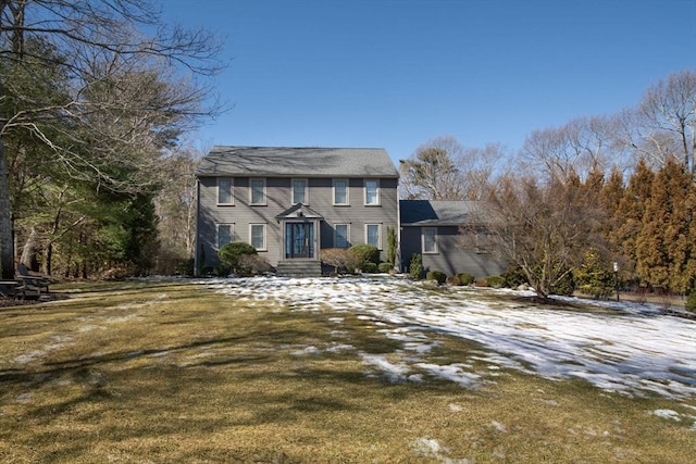 colonial inspired home with a front yard