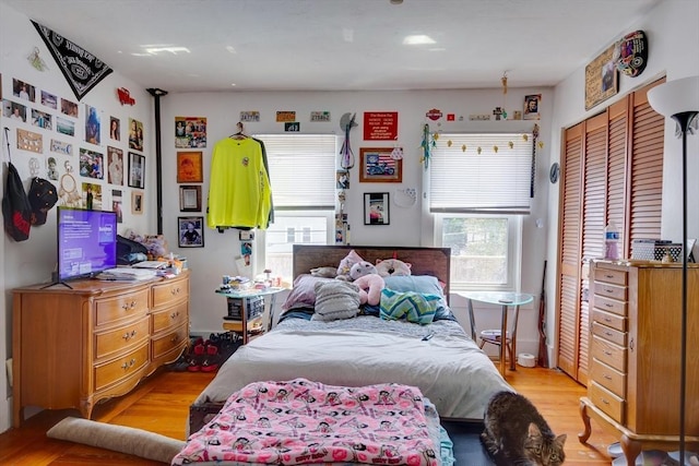 25-29 Chapel St, Norwood, MA 02062 - bedroom featuring light wood-type flooring and a closet