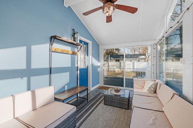 sunroom / solarium featuring lofted ceiling and ceiling fan