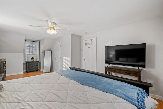 bedroom with wood-type flooring and ceiling fan