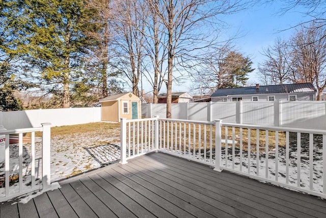 wooden terrace featuring a shed