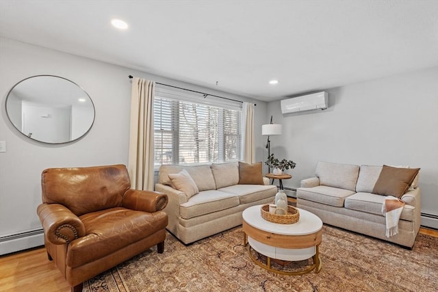 living room with hardwood / wood-style floors, a baseboard radiator, and a wall mounted AC