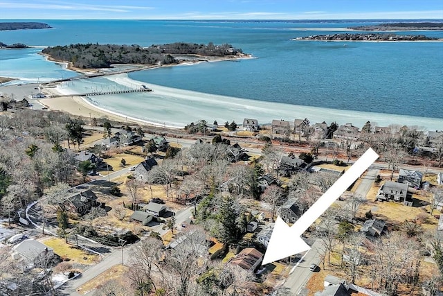 bird's eye view featuring a water view and a beach view