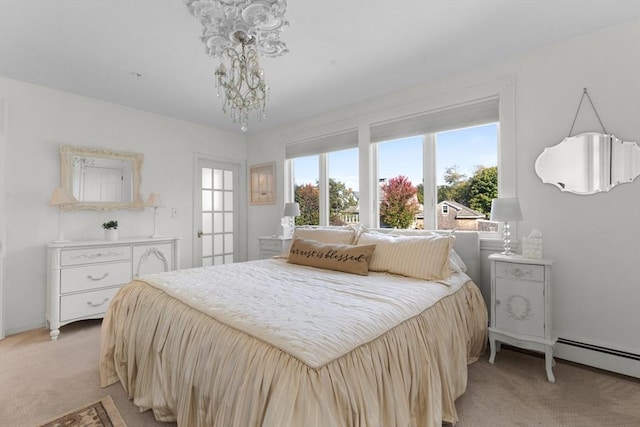 bedroom featuring a baseboard heating unit and light carpet