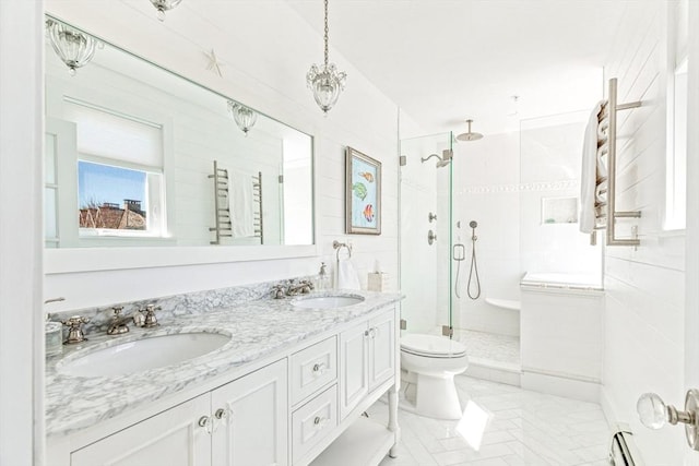 bathroom with toilet, a shower stall, double vanity, and a sink