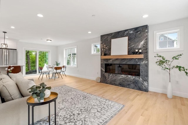 6 Sylvan Hill Xing, Haverhill, MA 01832 - living room with light wood-type flooring, baseboards, a high end fireplace, and recessed lighting