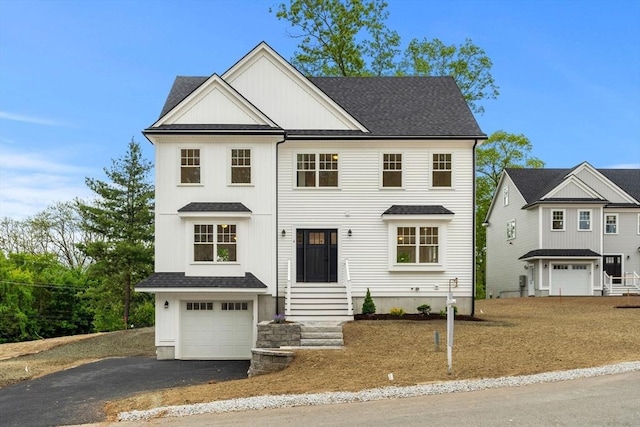 6 Sylvan Hill Xing, Haverhill, MA 01832 - view of front of house featuring a garage, entry steps, driveway, and roof with shingles