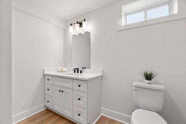 6 Sylvan Hill Xing, Haverhill, MA 01832 - half bath with baseboards, vanity, toilet, and wood finished floors