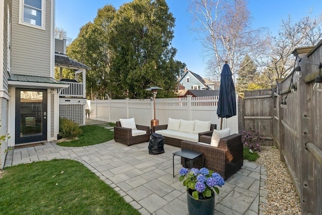 view of patio featuring an outdoor hangout area and a fenced backyard