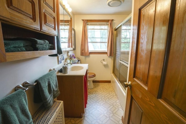 39 Crest Ave, Lunenburg, MA 01462 - bathroom with vanity, toilet, tile patterned floors, baseboards, and shower / bath combination with glass door