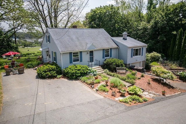 39 Crest Ave, Lunenburg, MA 01462 - new england style home featuring a chimney and roof with shingles