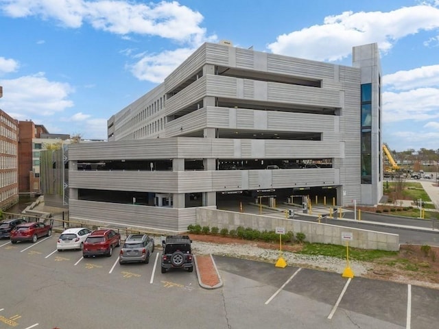 view of property featuring uncovered parking