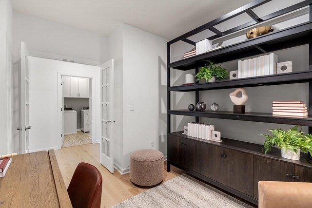 office space with separate washer and dryer, french doors, and light wood-style flooring