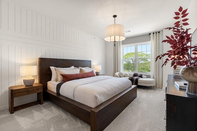 bedroom with light colored carpet and visible vents
