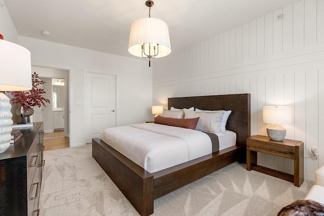 bedroom featuring light colored carpet