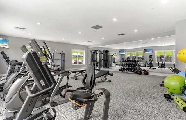 gym with plenty of natural light, recessed lighting, and visible vents