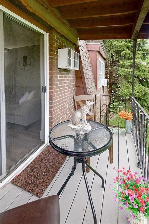 balcony with an AC wall unit