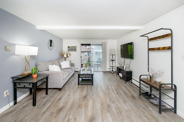 living area with light wood-style floors, baseboards, and beam ceiling