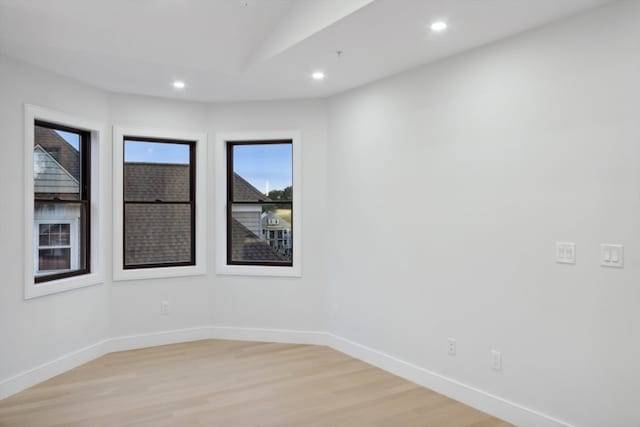 spare room featuring light hardwood / wood-style floors