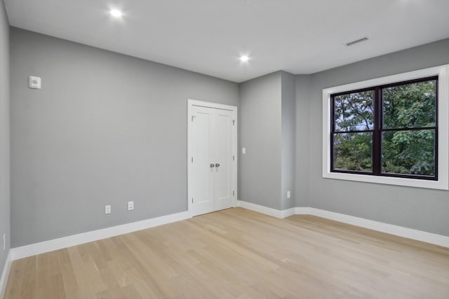 unfurnished room featuring light hardwood / wood-style floors