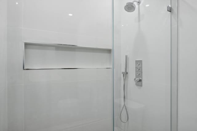 bathroom with a tile shower