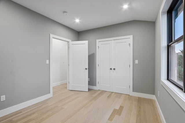 unfurnished bedroom with light wood-type flooring